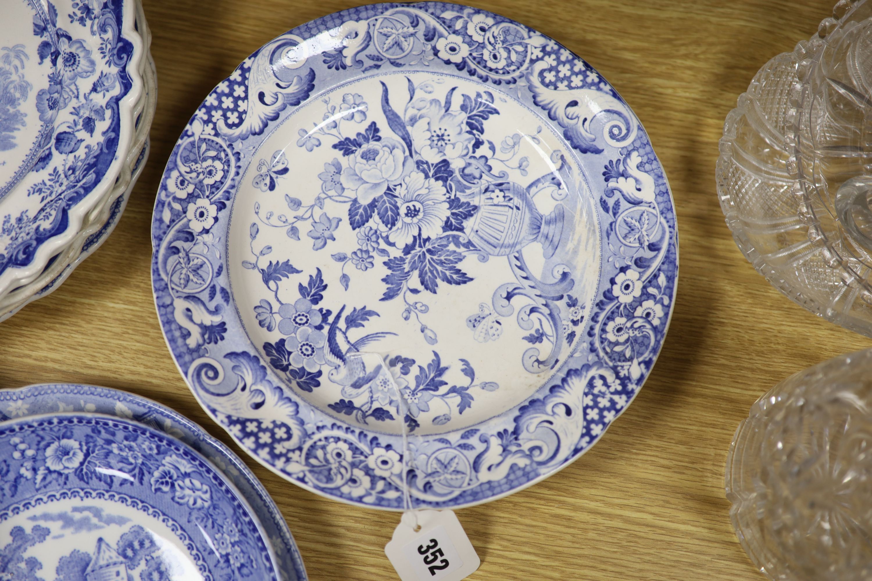 A collection of 19th and 20th century blue and white pottery plates and dishes